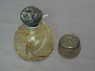 A cut glass globular shaped scent bottle with embossed silver lid 2" and a small rouge pot 1" (2)
