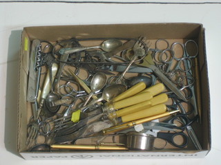 A collection of silver plated flatware, scissors etc