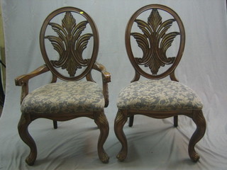 A set of 5 Hepplewhite style dining chairs with oval pierced backs decorated urns, the seats of serpentine outline, raised on cabriole supports  (4 carvers, 1 standard)