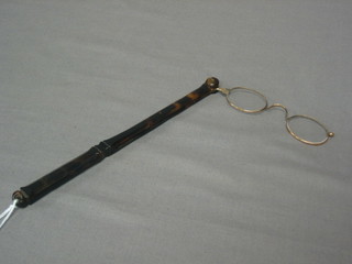 A pair of tortoiseshell and gilt metal lorgnettes