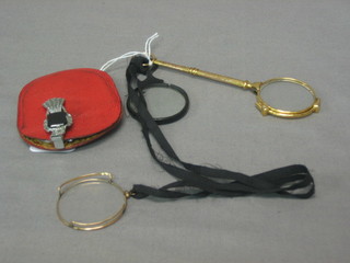 A pair of gilt metal lorgnettes and a pair of marcasite lorgnettes, a monocle and a prism glass