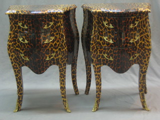 A pair of French style bombe shaped and serpentine fronted chests of 3 drawers, raised on cabriole supports, having a leopard skin effect finish 21"