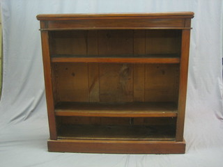 A Victorian mahogany open bookcase fitted adjustable shelves, raised on a platform base 41"