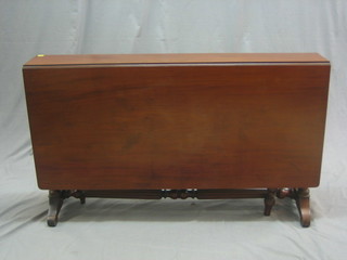 A Victorian mahogany drop flap Sutherland table, raised on turned and reeded supports 25"