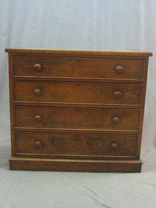 A Victorian mahogany chest of 4 long drawers with tore handles, raised on a platform base, 41"