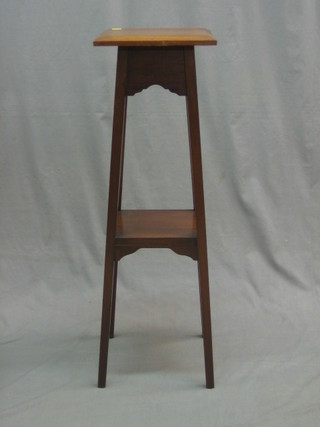A walnut 2 tier jardiniere stand, raised on square tapering supports 11"