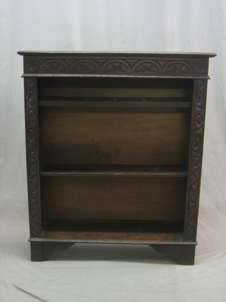 A Victorian carved oak bookcase, fitted adjustable shelves 36"