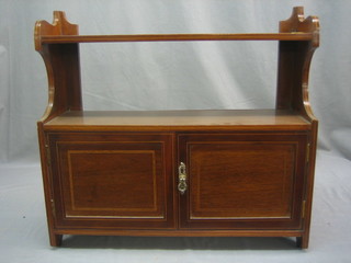 An Edwardian inlaid mahogany hanging cabinet enclosed by a panelled door 23"