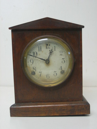 A Gloucester 8 day mantel clock contained in an oak case