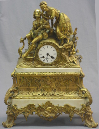 An impressive French 19th Century mantel clock with enamelled dial and Arabic numerals contained in a white marble and gilt metal case, surmounted by a figure of a minstrel