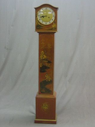 A 1930's 8 day chiming Granddaughter clock with Arabic numerals, contained in a red lacquered case with chinoiserie decoration 52"