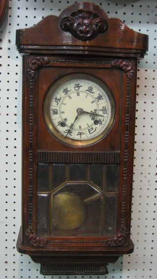 A 19th Century 8 day striking wall clock, the 5" dial with Roman numerals and Oriental characters, contained in a mahogany case