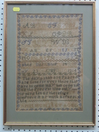 A 19th Century wool work sampler with alphabet letters and motto by Ann Huntley 13" x 9"