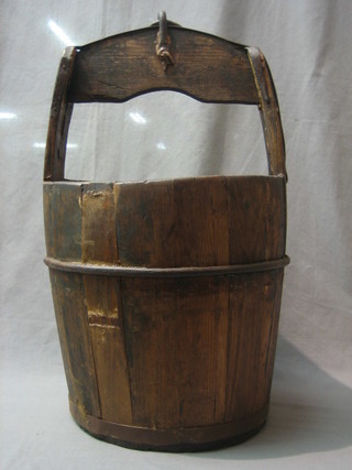 A reproduction Eastern wooden well bucket