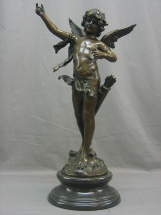 A reproduction bronze figure of a standing cherub, raised on a marble base 28"