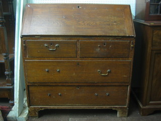 A Georgian oak bureau with fall front revealing a well fitted interior above 2 short and 2 long drawers, raised on bracket feet 38"
