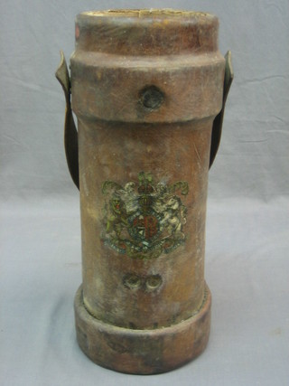 A cylindrical leather cordite carrier decorated The Royal Coat of Arms
