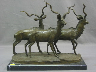 A reproduction bronze figure group of 3 standing antelopes, raised on a marble base 17"