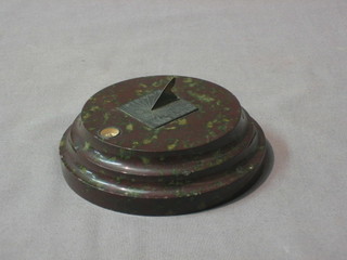 An Art Deco Bluejohn paperweight in the form of a sun dial set a compass 4 1/2"