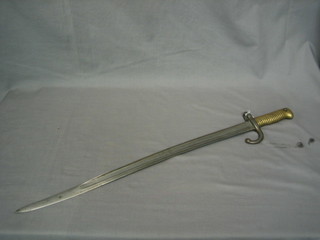 A French chassepot bayonet with brass grip, the blade dated 1871