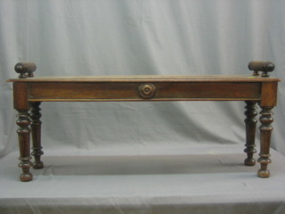 A 19th Century oak hall bench raised on paw supports 42"
