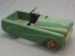 A childs 1950's pressed metal pedal car (some rust)