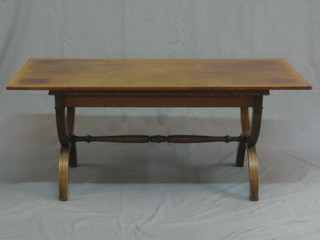 A Georgian style rectangular mahogany coffee table with crossbanded top, raised on X framed supports 42"