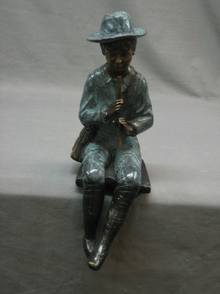 A Victorian style bronze figure of a seated boy with whistle 14"