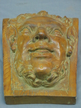 A carved "yew" keystone in the form of a portrait bust 10"