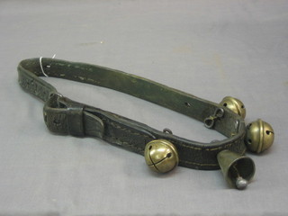 A 19th Century leather strap hung 4 bells