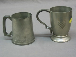 A Tudric pewter tankard, decorated The Arms of Surrey RA and 1 other tankard