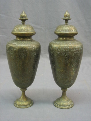 A pair of Benares brass urns and covers 12"