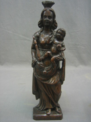 A carved oak figure of a standing mother and child 15"