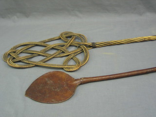 A carpet beater and an Eastern leather whip