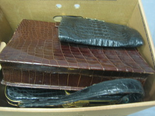 A leather attache case, a black leather handbag, a crocodile clutch bag, a crocodile handbag and 3 other handbags