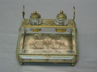 A Victorian bevelled glass and gilt metal inkwell/trinket box fitted 2 small inkwells, the base with hinged lid 5"