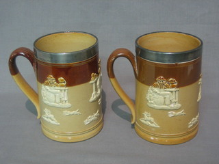 A pair of Doulton Lambeth Harvestware tankards, the base marked Doulton Lambeth with metal rims (slight chip to handle)