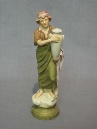 A  Royal Dux figure of a standing lady with amphora, raised on a circular base with pink Royal Dux mark, impressed 217 7"