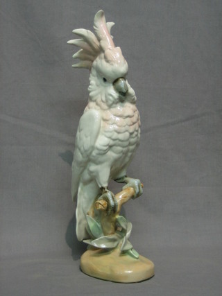 A Royal Dux figure of a seated cockatoo, the base with pink Royal Dux mark, 16"