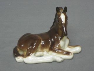 A Soviet Russian porcelain figure of a seated foal, base marked in USSR 4"