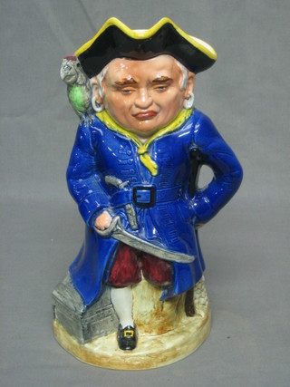 A musical pottery Toby jug in the form of a pirate 10" and 1 other (2)