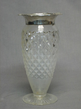 A cut glass vase with silver rim, raised on a spreading foot 8"