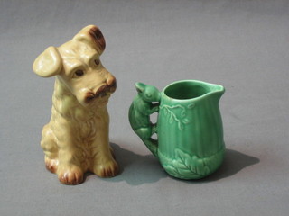 A Sylvac figure of a seated dog, base marked 1570 Sylvac, 5" and a green glazed Sylvac jug, the handle in the form of a squirrel 3"