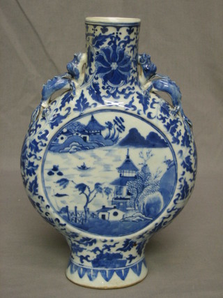An Oriental twin handled blue and white moon flask decorated Pagodas 12"