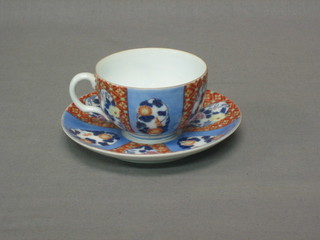A 19th Century Imari cup and saucer with panel decoration
