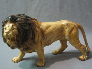 A Melba ware pottery figure of a walking lion 13"