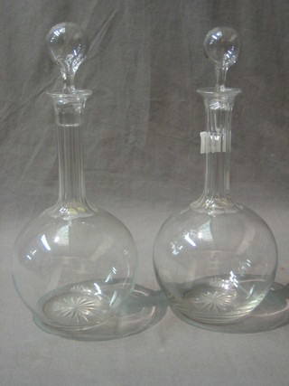 A pair of club shaped glass decanters and stopper
