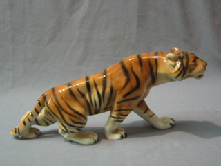 A Royal Dux figure of a walking tiger, the base with pink triangular Royal Dux mark 6"