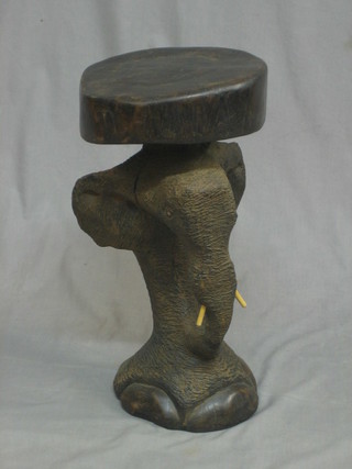 An Eastern carved hardwood stool in the form of an elephant
