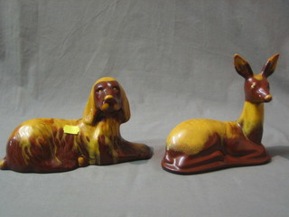 A Canadian Blue Mountain figure of a seated deer 6" and a ditto dog 9" (slight crack to body)